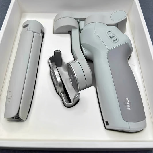 DJI Osmo Mobile SE OM Handheld Gimbal Stabilizer, a portable, foldable, intelligent follow - shooting and anti - shake mobile phone selfie gadget that is compatible with various devices
